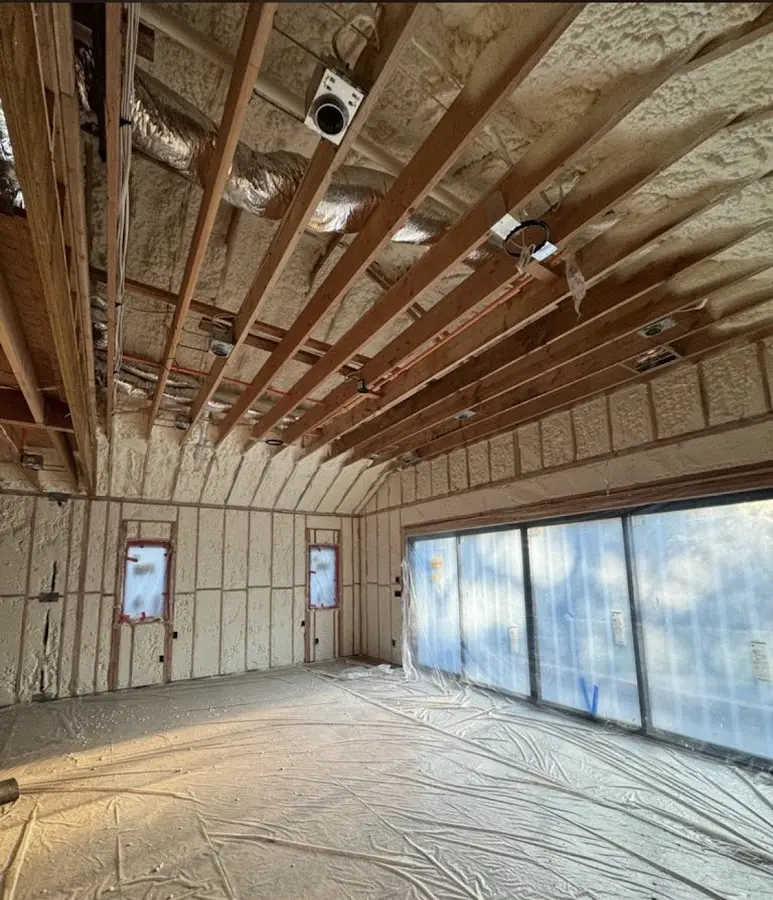 Interior walls and ceiling insulated with spray foam during new construction in Johns Creek